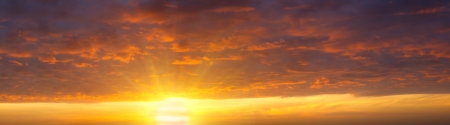 sunrise over the sea and the beach with clear skiesの写真素材