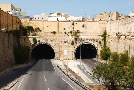 highway and steep walls around the tunnel in Maltaの写真素材