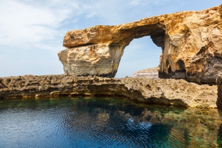 Azure Window, famous stone arch of Gozo island in the sun in summer, Maltaの写真素材