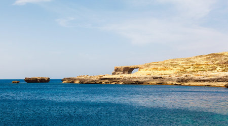 Azure Window, famous stone arch of Gozo island in the sun in summer, Maltaの写真素材