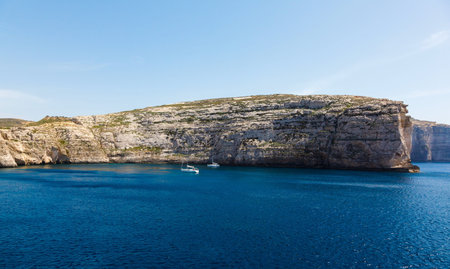 Fungus Rock, General's Rock, entrance to the Dwajra Bay, Gozo, Malta in the sun in summerの写真素材