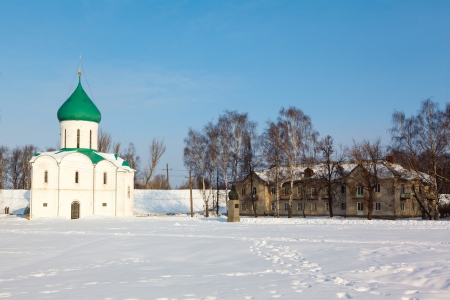 white steeple and Holy Transfiguration Cathedral on a background of blue sky with reflection in waterの写真素材