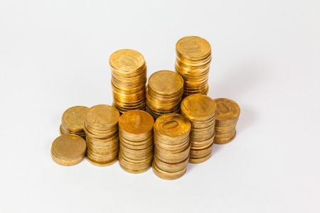lot of golden coins on white backgroundの写真素材