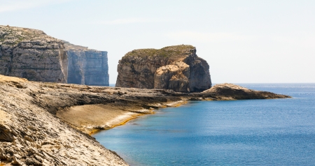Fungus Rock, General's Rock, entrance to the Dwajra Bay, Gozo, Malta in the sun in summerの写真素材