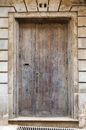 old wooden front door to the house in the Mediterraneanの写真素材