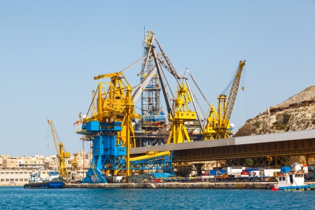 Oil platform repair Shipyards harbor of Malta in clear weather on a background of blue skyの写真素材