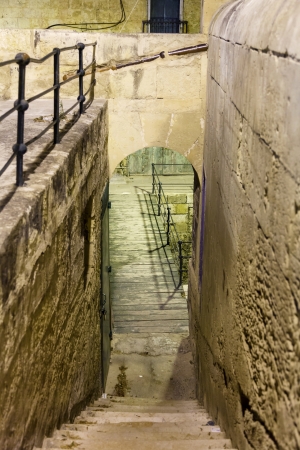 narrow old street and stairs in Valletta in a warm summer nightの写真素材