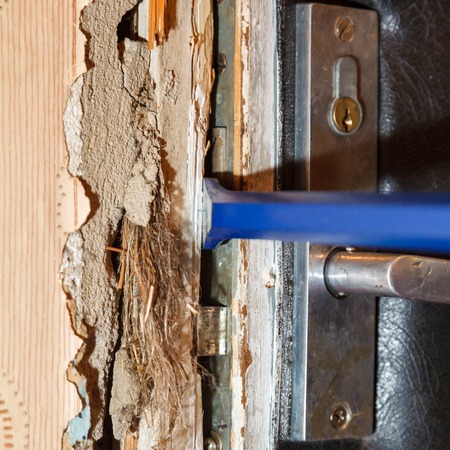 Hack the door with a crowbar, apartment robberyの写真素材