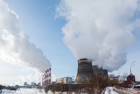 Smoking pipes of thermal power plant against blue skyのeditorial素材