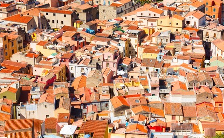 Colorful houses and red roofs of Bosa town in Sardiniaの写真素材