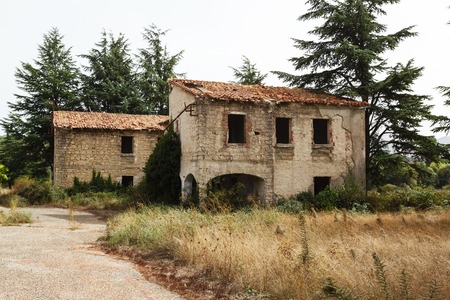 ruined buildings of stone in abandoned monastery in Sardiniaの写真素材