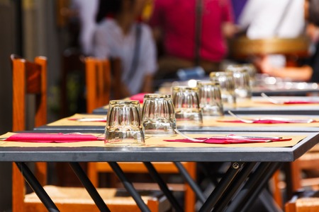 tables with glasses at an outdoor cafe in Florenceの写真素材