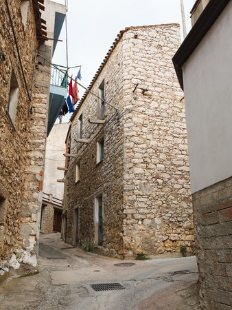 the narrow streets of the mountain town of Baunei in Italy, Sardiniaの写真素材