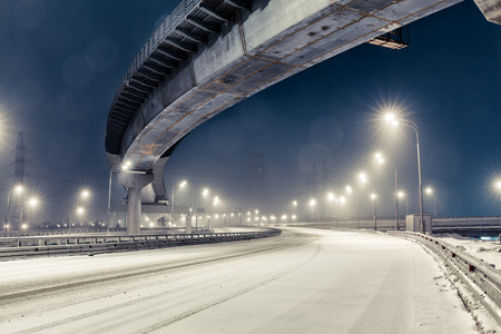 transport metropolis, traffic and blurry lights of cars on multi-lane highways and  road junction at night in Moscowの写真素材