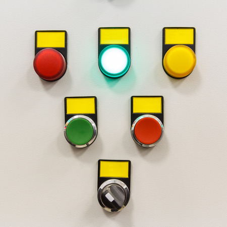 White electrical panel with multi colored indicatorsの写真素材
