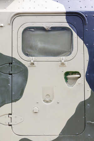armored door in a military vehicle in a protective colorationの写真素材