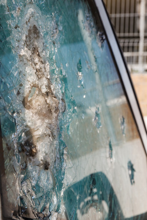 bulletproof glass car after the shooting with traces of bulletsの写真素材