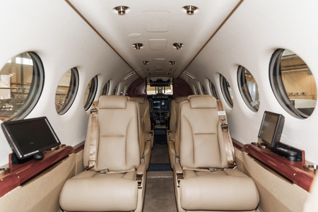 Luxury interior in bright colors of genuine leather in the aircraft business aviationの写真素材