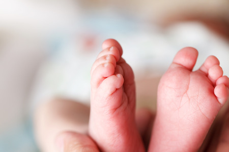 Beautiful Soft newborn baby feet close upの写真素材