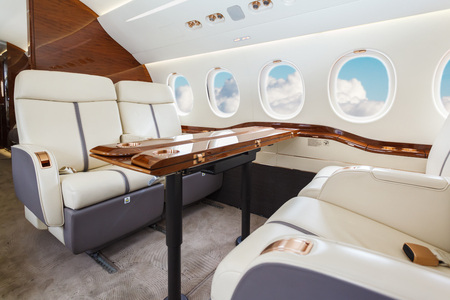 Luxury interior in bright colors of genuine leather in the business jetの写真素材