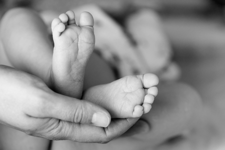 Beautiful Soft newborn baby feet close upの写真素材