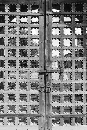 old wooden lattice on the gates in a monastery Russia