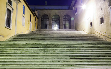 ladder in the light of lanterns at night in Romeの写真素材