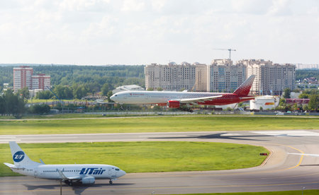 VNUKOVO, MOSCOW REGION, RUSSIA - 17 June , 2016: Airplanes in Vnukovo international airport. Russia Airlines Boeing 777 landing to runwayのeditorial素材