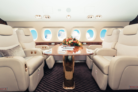 Luxury interior in bright colors of genuine leather in the business jet