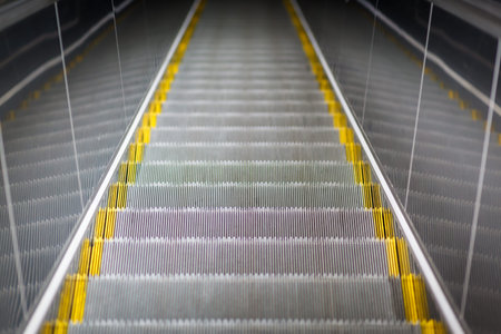 ladder escalator close-up, metal railing