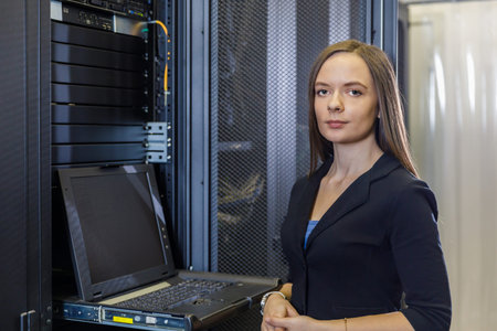 Young engineer and businesswoman with the management console