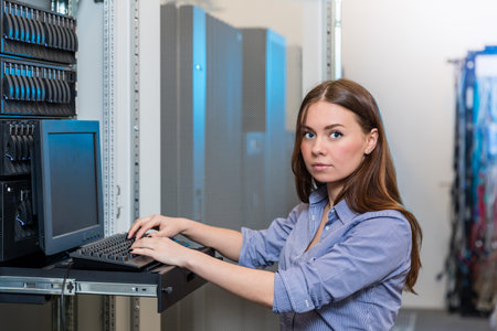 Young engineer and businesswoman with the management consoleの写真素材