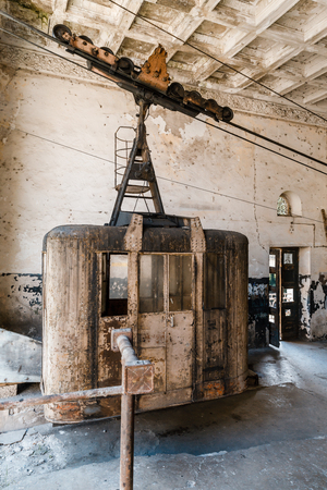Old soviet rusty and functioning ropeway or cable car cabins in Chiatura, Georgiaの写真素材