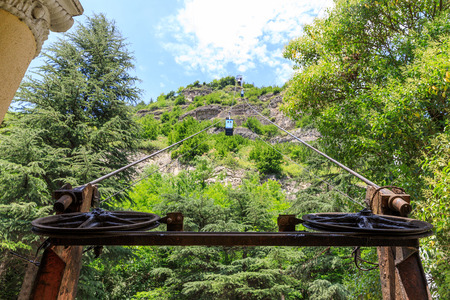 Old soviet rusty and functioning ropeway or cable car cabins in Chiatura, Georgiaの写真素材