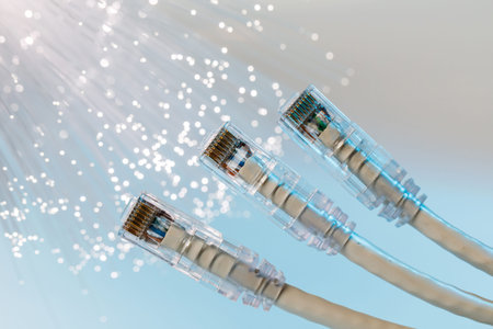 Closeup of internet cable on the background of optical fibers with blurred lights.