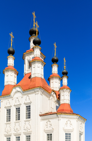 Russian white orthodox Temple of the Entry of the Lord into Jerusalem against the blue sky The Nativity Church, Totma, Russia. Architectural forms reminiscent of a ship.の写真素材