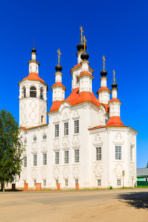 Russian white orthodox Temple of the Entry of the Lord into Jerusalem against the blue sky The Nativity Church, Totma, Russia. Architectural forms reminiscent of a ship.の写真素材