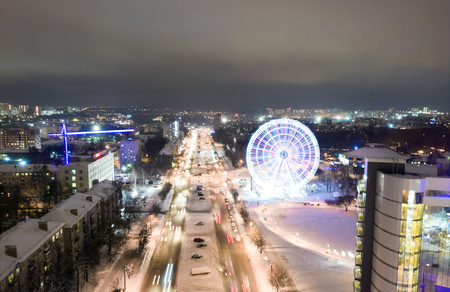 panorama of the Russian city of Kirov from a height on a winter night. Oktyabrsky Avenue and Ferris Wheel in the New Year holidays.の写真素材
