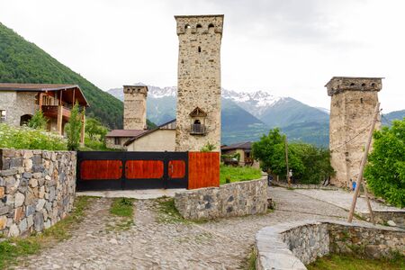 View of the Ushguli village at the foot of Mt. Shkhara. Picturesque and gorgeous scene. Rock tower towers and old houses in Ushguliの写真素材