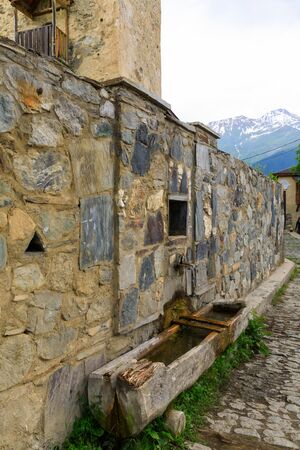 Old wooden old cattle drinker in Svaneti region, Georgia. It is a highland townlet in the northwest of Georgia, at an elevation of 1500 meters in the Caucasus Mountains.の写真素材