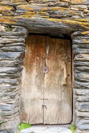 Old wooden gate in Svaneti region, Georgia. It is a highland townlet in the northwest of Georgia, at an elevation of 1500 meters in the Caucasus Mountains.の写真素材