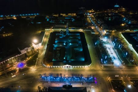 Red shopping arcades on Susaninskaya Square in the center of the ancient city of Kostroma at winter night, Russia.の写真素材