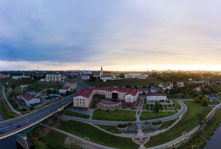 Grodno Regional Drama Theater and Holy Cross Church And Traffic In Mostowaja And Kirova Streets in the morning light. Grodno city in Belarus. Aerial view from a drone.の写真素材