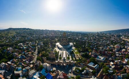 Panorama of the Tbilisi and Holy Trinity Cathedral of Tbilisi commonly known as Sameba, the biggest cathedral of Georgian Orthodox Church located in Tbilisi, the capital of Georgia.の写真素材