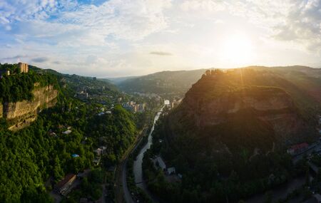 The city of Chiatura and the Mining plant and manganese ore processing plant located in the gorge of the Kvirila River, a tributary of the Rioni and on adjacent plateaus.の写真素材