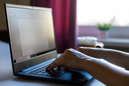 Female hand on a laptop, touchpad. remote work at the laptop. concept of Remote work or Freelance at...