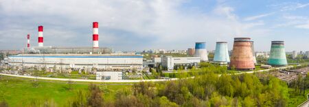 power plant pipes and cooling towers on the background of the panorama of the Moscow city against blue sky. Biryulyovo district in the south of Moscow.の写真素材