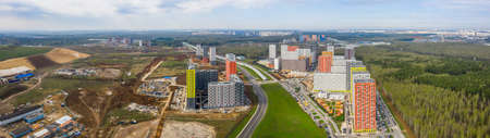 New residential areas and new buildings in Moscow. Aerial view of the area near the Salaryevo landfill and a new metro line.の写真素材
