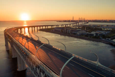 High-speed toll road, highway bypassing the city center St. Petersburg, the central section of the western high-speed section. A beautiful view of the sunset over the Gulf of Finlandの写真素材