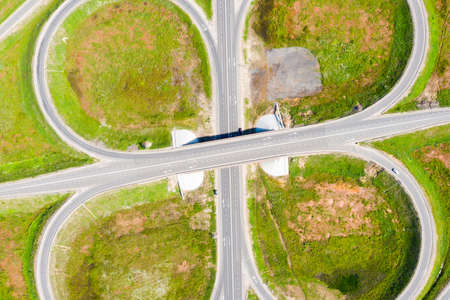 Clover or daisy, a simple and cheap type of road junction. Aerial view of highway road junction in the in the Kostroma region, Russia.の写真素材